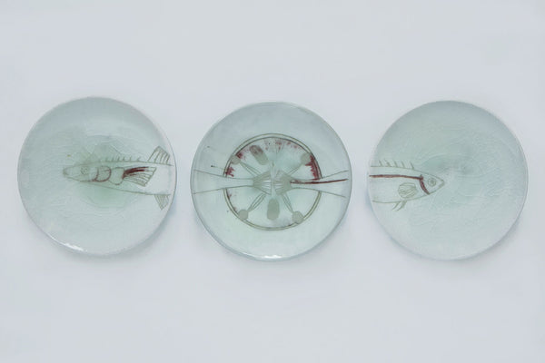 Set of irish ceramic plates, with a fish motif, in traditional green color