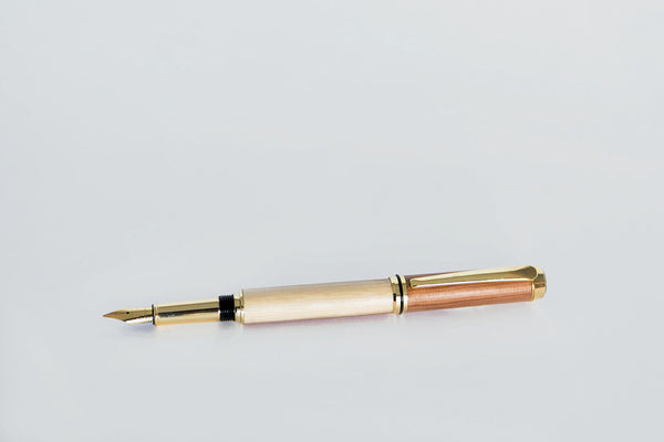 Scribes pen crafted from native irish wood and tipped with Irish copper