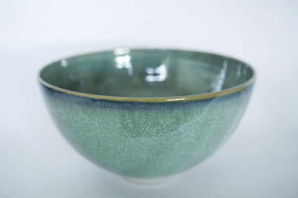 Green and white speckled salad bowl with a blue line around the rim makes a lovely irish craft gift