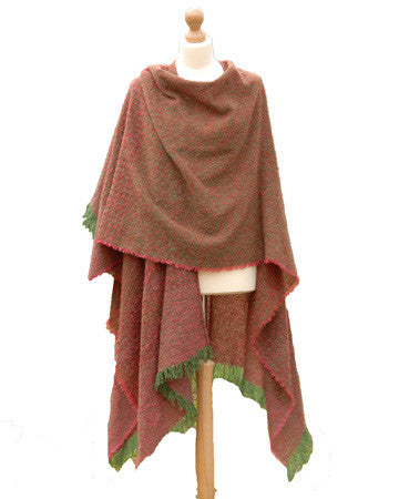 Shop this Irish Kelly Rose Celtic Ruana with shades of pink and brown with green edging on a tailor's Mannequin